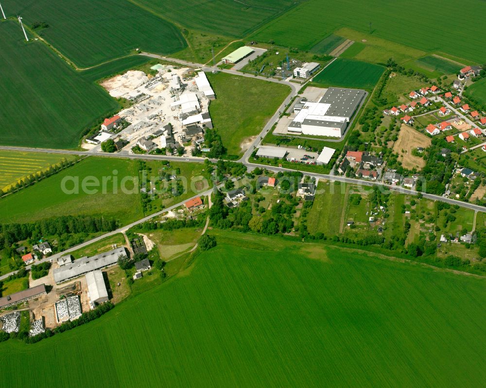 Beiersdorf from the bird's eye view: Agricultural land and field boundaries surround the settlement area of the village in Beiersdorf in the state Thuringia, Germany