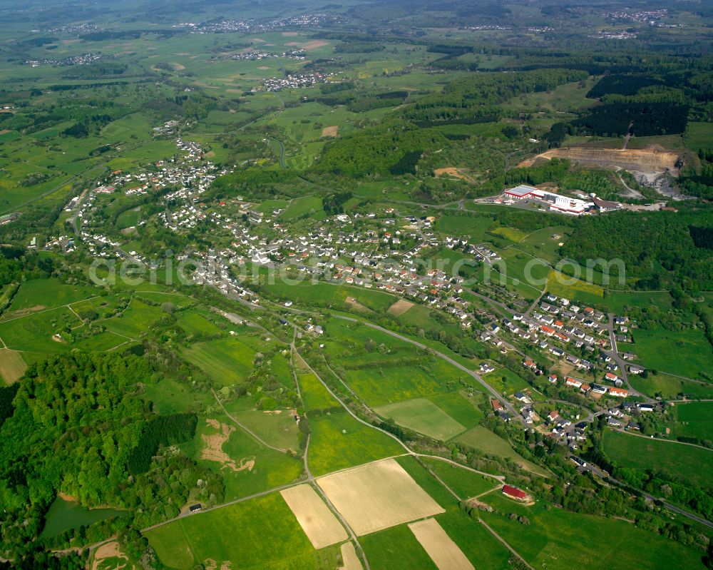 Aerial photograph Beilstein - Agricultural land and field boundaries surround the settlement area of the village in Beilstein in the state Hesse, Germany