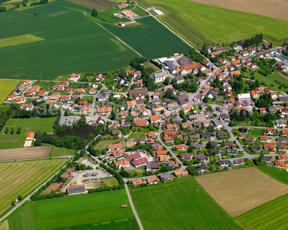 Bellamont from above - Agricultural land and field boundaries surround the settlement area of the village in Bellamont in the state Baden-Wuerttemberg, Germany