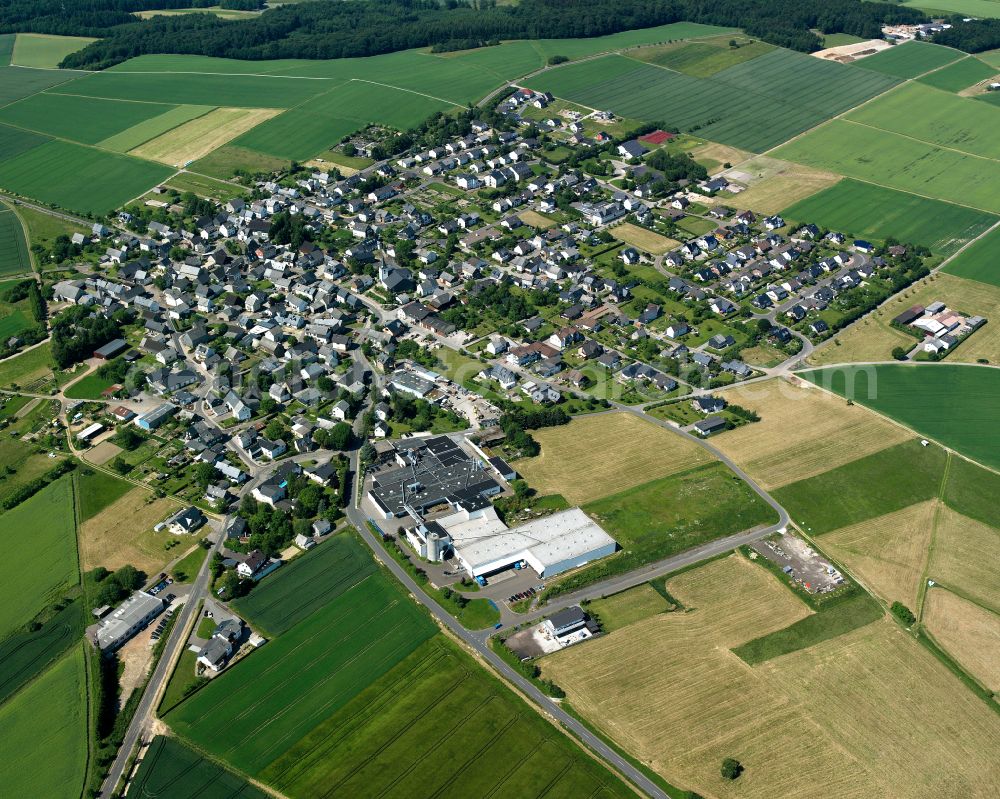 Beltheim from above - Agricultural land and field boundaries surround the settlement area of the village in Beltheim in the state Rhineland-Palatinate, Germany