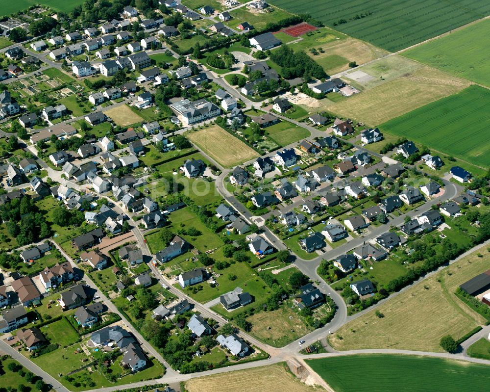 Aerial photograph Beltheim - Agricultural land and field boundaries surround the settlement area of the village in Beltheim in the state Rhineland-Palatinate, Germany