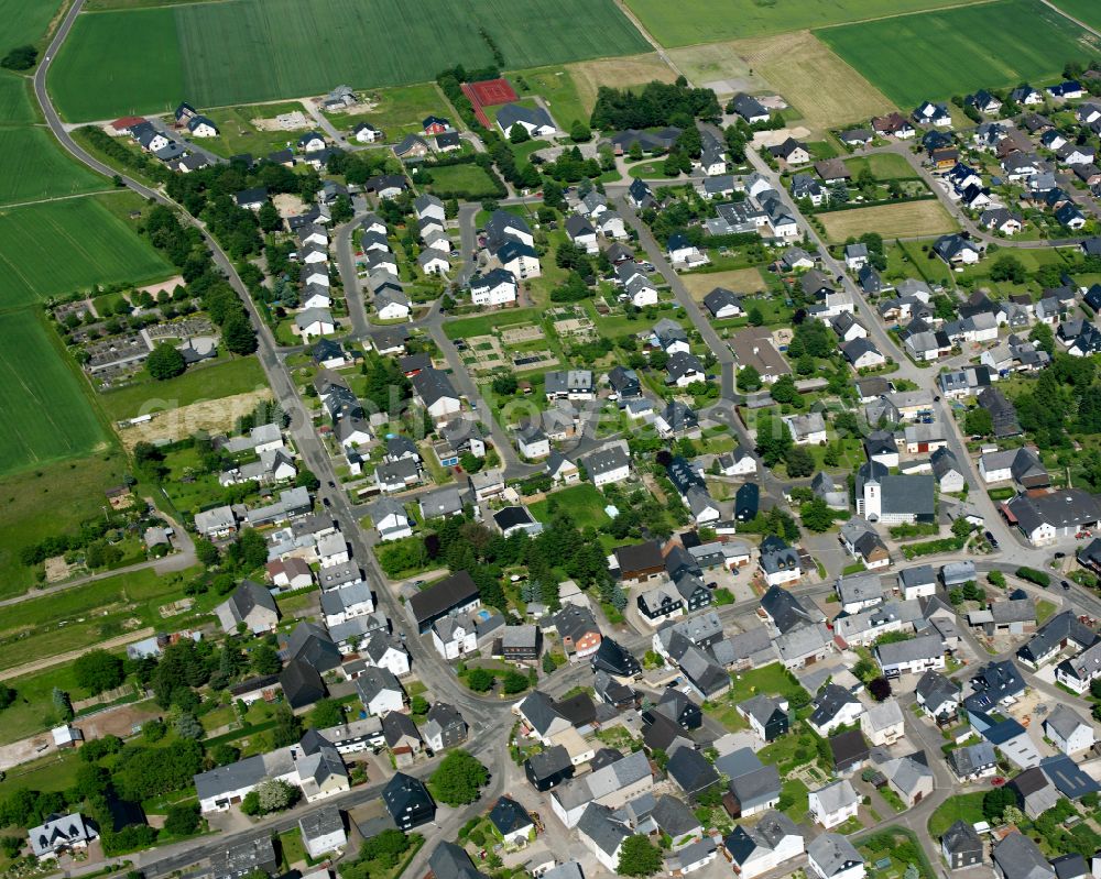 Beltheim from the bird's eye view: Agricultural land and field boundaries surround the settlement area of the village in Beltheim in the state Rhineland-Palatinate, Germany