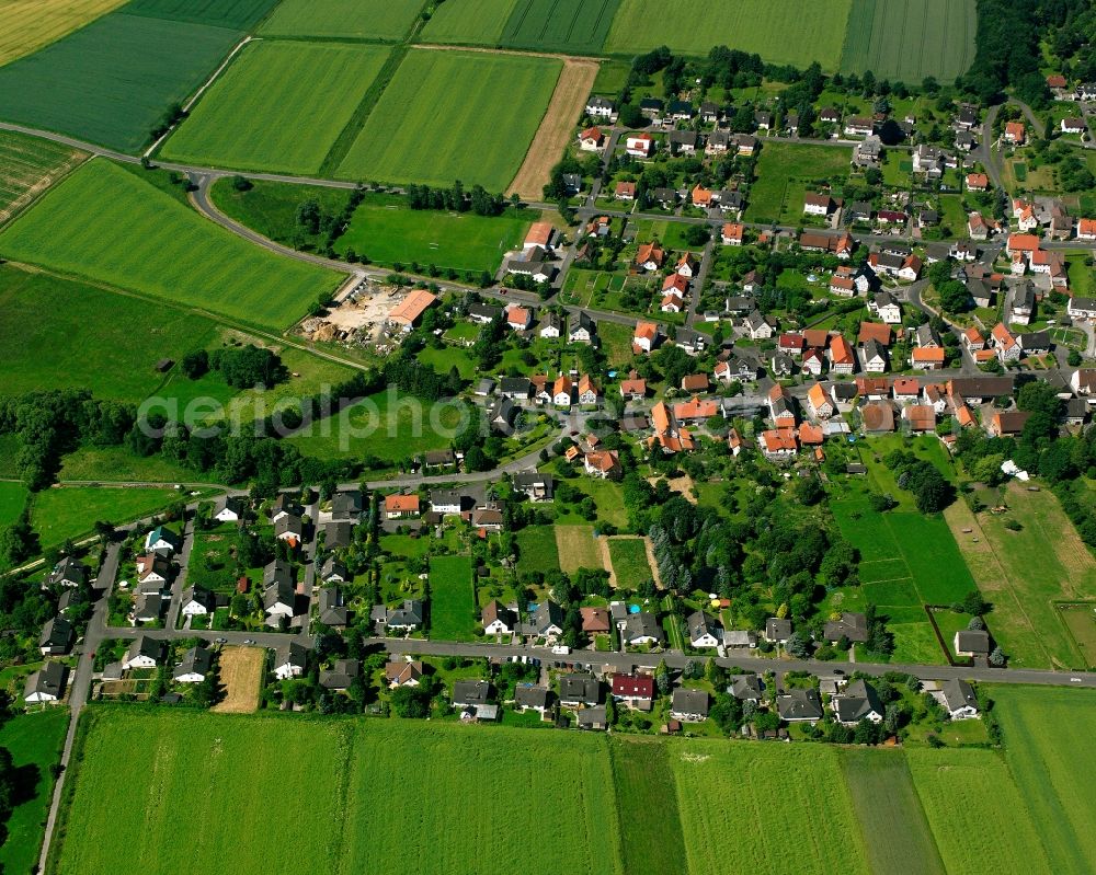 Benterode from above - Agricultural land and field boundaries surround the settlement area of the village in Benterode in the state Lower Saxony, Germany