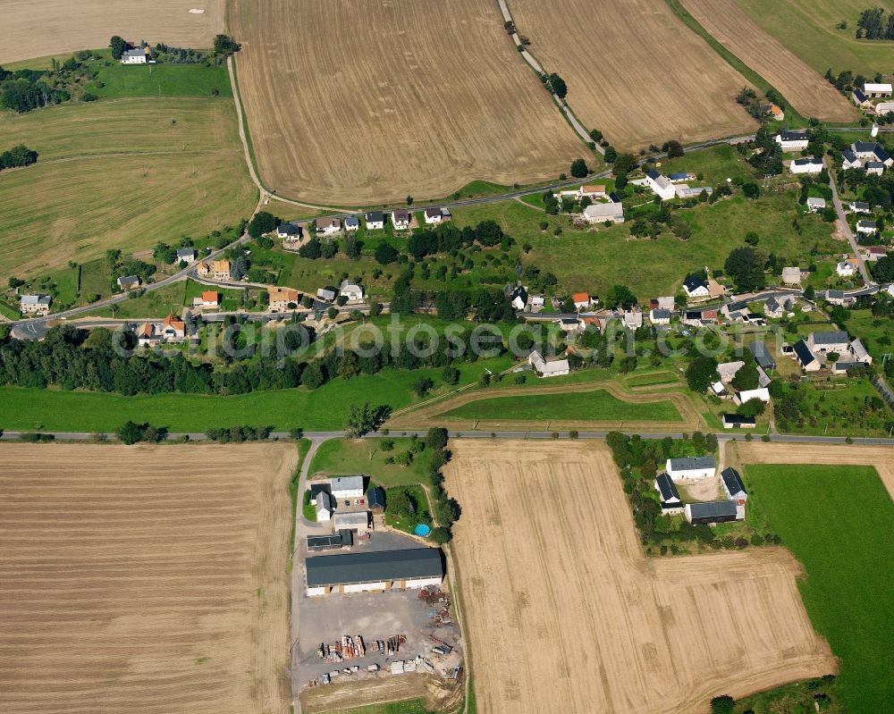 Berbersdorf from the bird's eye view: Agricultural land and field boundaries surround the settlement area of the village in Berbersdorf in the state Saxony, Germany