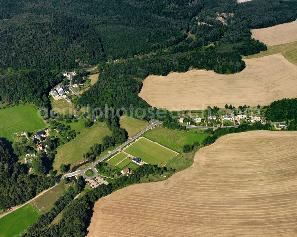 Aerial image Berbersdorf - Agricultural land and field boundaries surround the settlement area of the village in Berbersdorf in the state Saxony, Germany