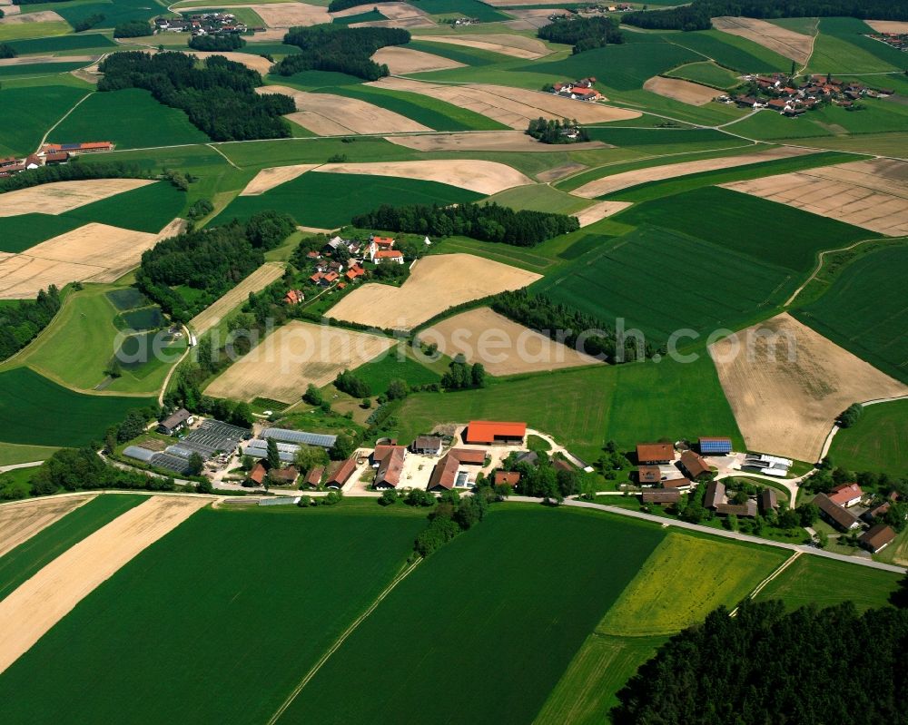 Bergham from above - Agricultural land and field boundaries surround the settlement area of the village in Bergham in the state Bavaria, Germany