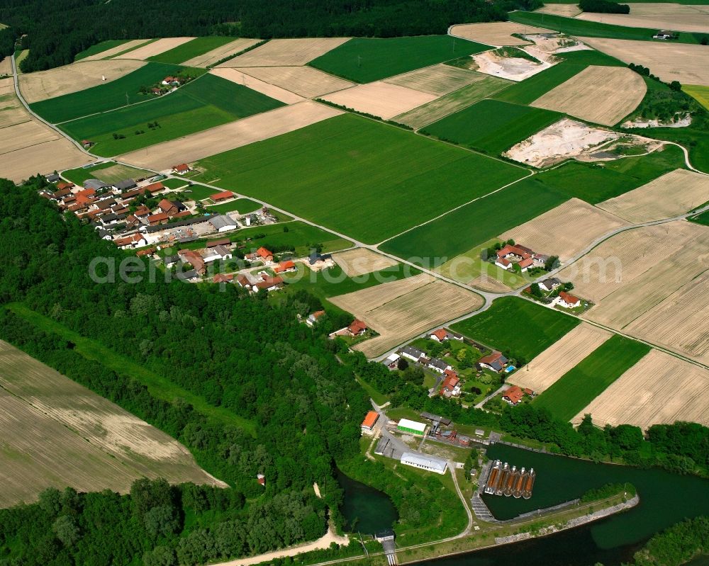 Bergham from the bird's eye view: Agricultural land and field boundaries surround the settlement area of the village in Bergham in the state Bavaria, Germany