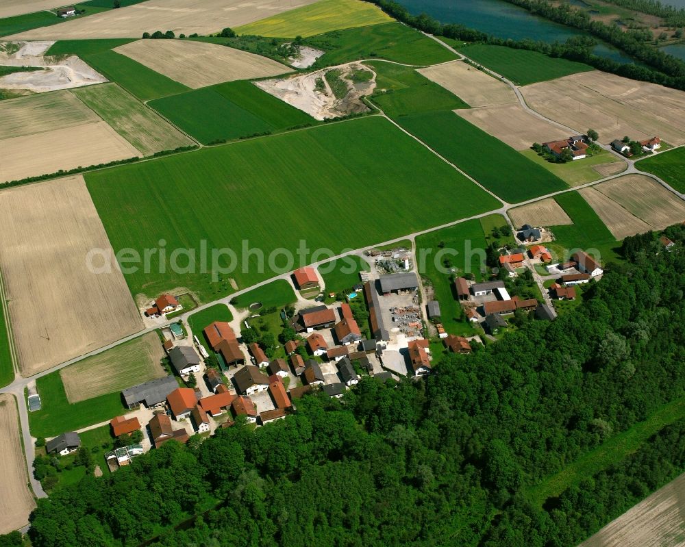 Bergham from above - Agricultural land and field boundaries surround the settlement area of the village in Bergham in the state Bavaria, Germany