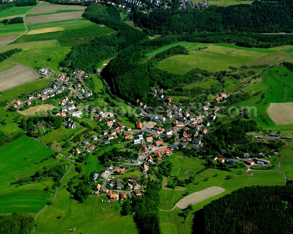 Aerial image Berglangenbach - Agricultural land and field boundaries surround the settlement area of the village in Berglangenbach in the state Rhineland-Palatinate, Germany