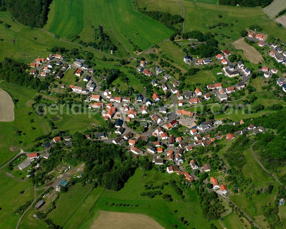 Berglangenbach from above - Agricultural land and field boundaries surround the settlement area of the village in Berglangenbach in the state Rhineland-Palatinate, Germany