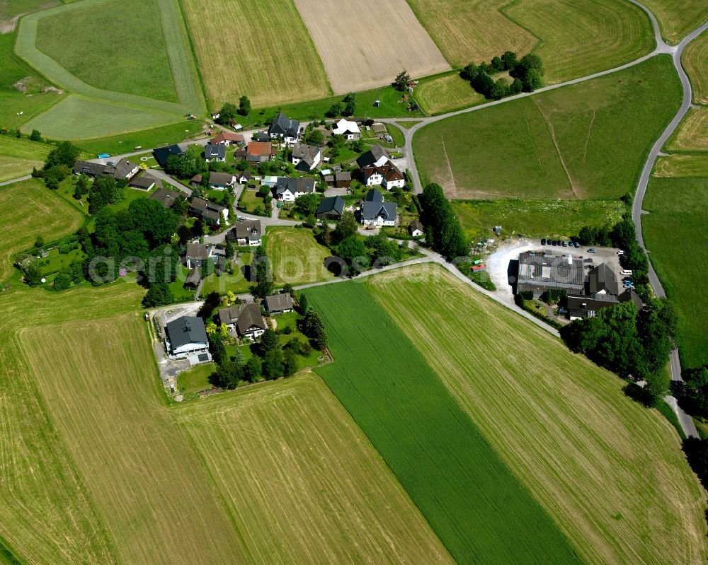 Berken from the bird's eye view: Agricultural land and field boundaries surround the settlement area of the village in Berken in the state North Rhine-Westphalia, Germany