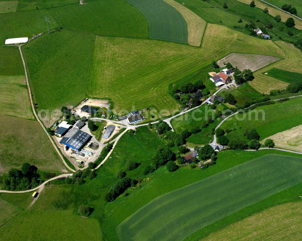 Aerial image Berken - Agricultural land and field boundaries surround the settlement area of the village in Berken in the state North Rhine-Westphalia, Germany