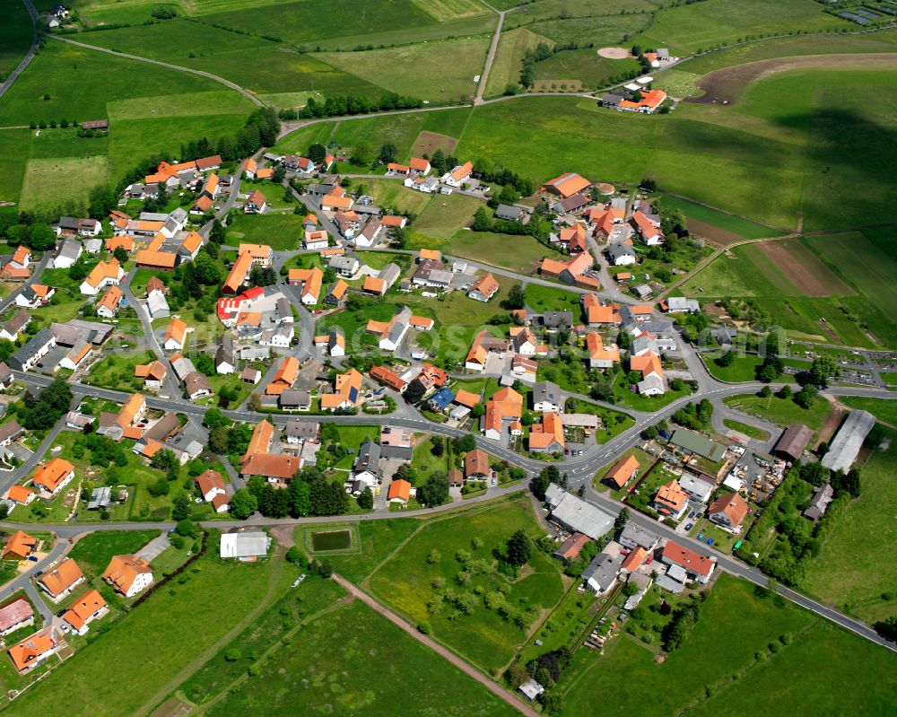 Bermuthshain from the bird's eye view: Agricultural land and field boundaries surround the settlement area of the village in Bermuthshain in the state Hesse, Germany