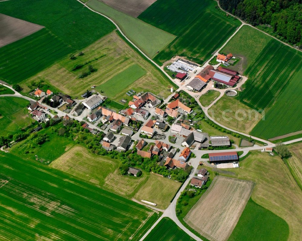 Berndorf from above - Agricultural land and field boundaries surround the settlement area of the village in Berndorf in the state Bavaria, Germany