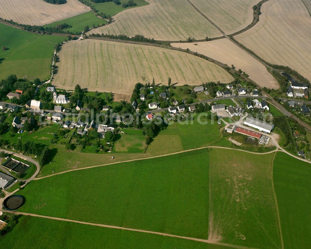 Berthelsdorf from above - Agricultural land and field boundaries surround the settlement area of the village in Berthelsdorf in the state Saxony, Germany