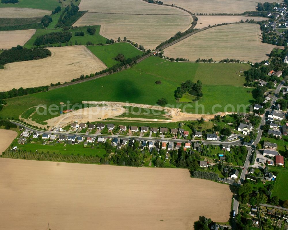 Aerial image Berthelsdorf - Agricultural land and field boundaries surround the settlement area of the village in Berthelsdorf in the state Saxony, Germany