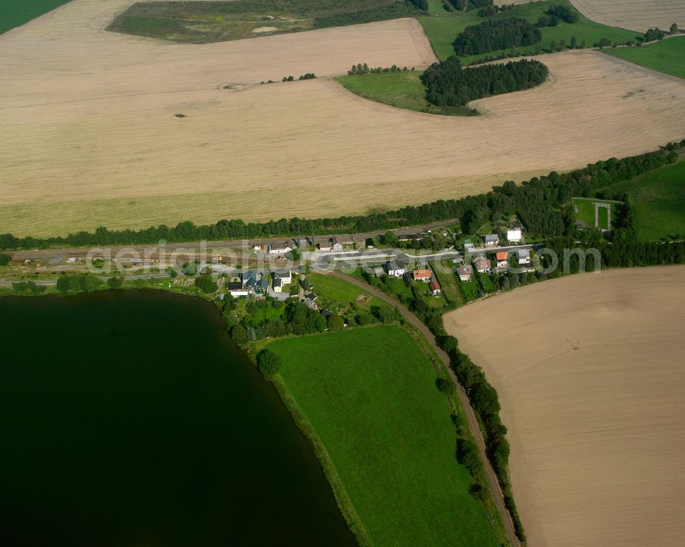 Aerial photograph Berthelsdorf - Agricultural land and field boundaries surround the settlement area of the village in Berthelsdorf in the state Saxony, Germany