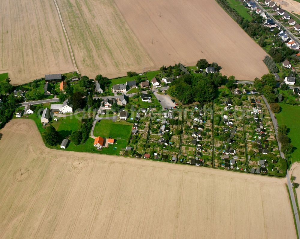 Berthelsdorf from above - Agricultural land and field boundaries surround the settlement area of the village in Berthelsdorf in the state Saxony, Germany