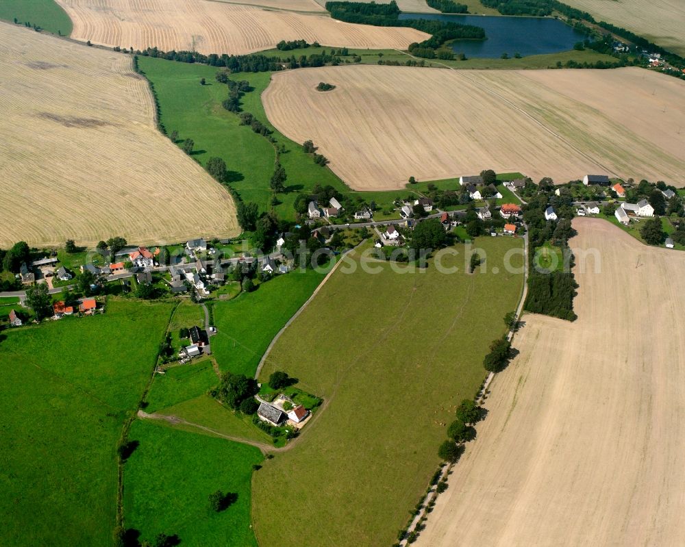 Berthelsdorf from the bird's eye view: Agricultural land and field boundaries surround the settlement area of the village in Berthelsdorf in the state Saxony, Germany