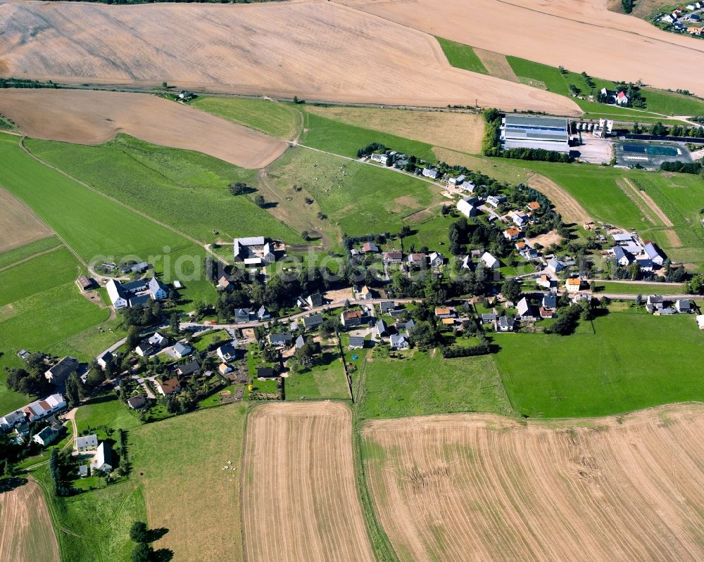 Berthelsdorf from the bird's eye view: Agricultural land and field boundaries surround the settlement area of the village in Berthelsdorf in the state Saxony, Germany