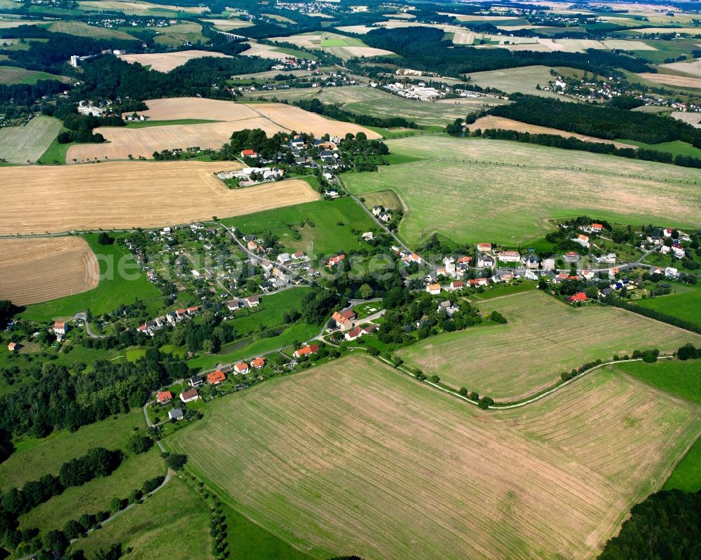 Berthelsdorf from the bird's eye view: Agricultural land and field boundaries surround the settlement area of the village in Berthelsdorf in the state Saxony, Germany