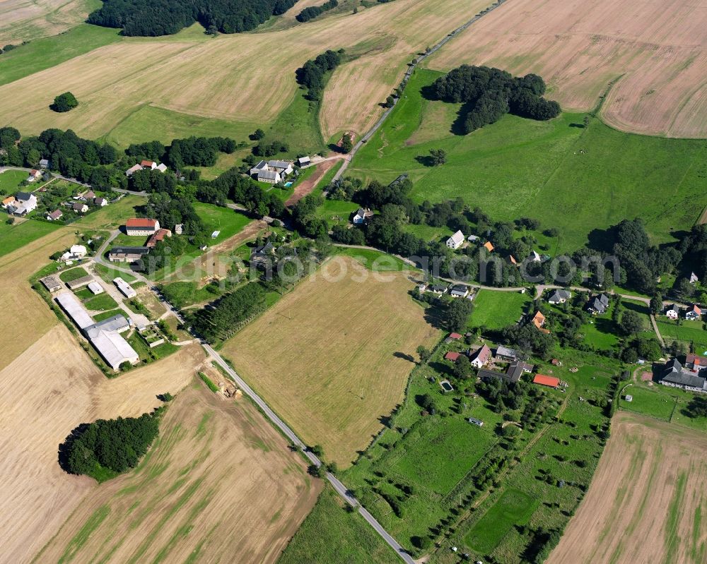 Berthelsdorf from the bird's eye view: Agricultural land and field boundaries surround the settlement area of the village in Berthelsdorf in the state Saxony, Germany