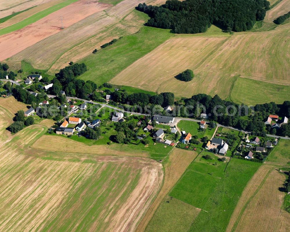 Aerial image Berthelsdorf - Agricultural land and field boundaries surround the settlement area of the village in Berthelsdorf in the state Saxony, Germany