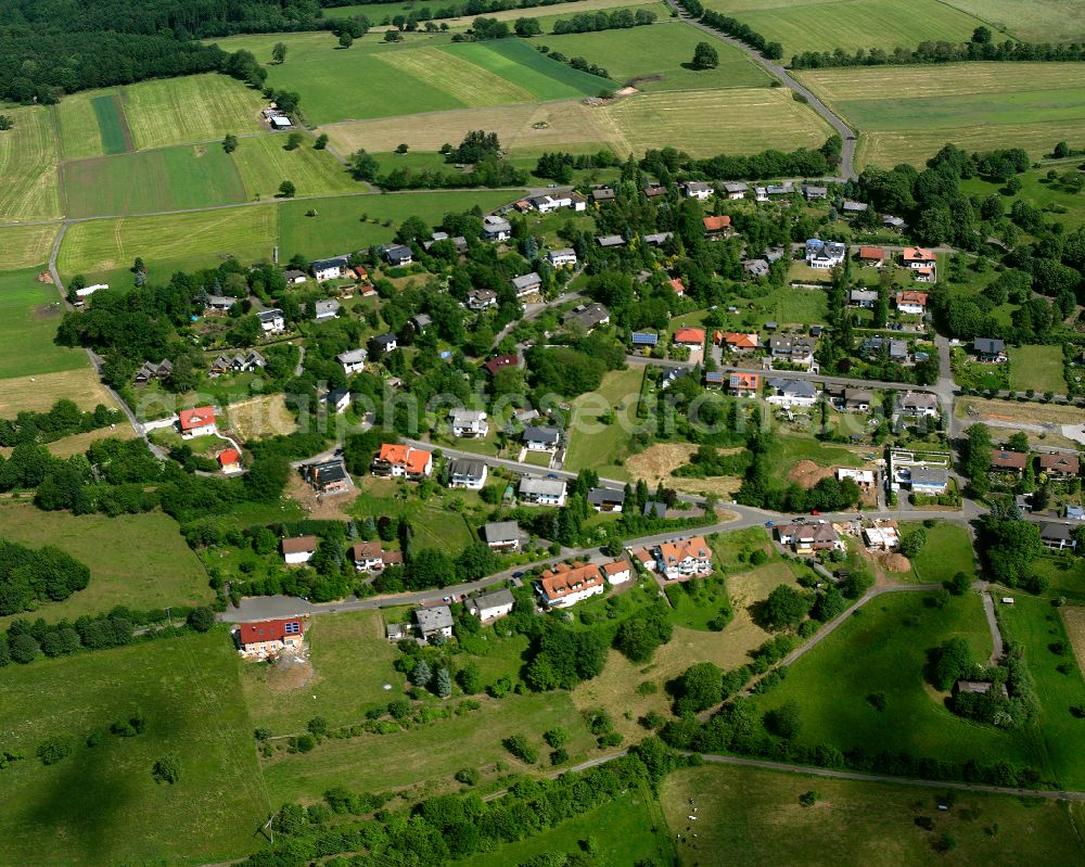 Aerial image Betzenrod - Agricultural land and field boundaries surround the settlement area of the village in Betzenrod in the state Hesse, Germany