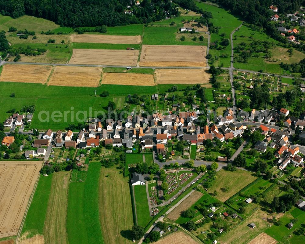 Beuern from above - Agricultural land and field boundaries surround the settlement area of the village in Beuern in the state Hesse, Germany