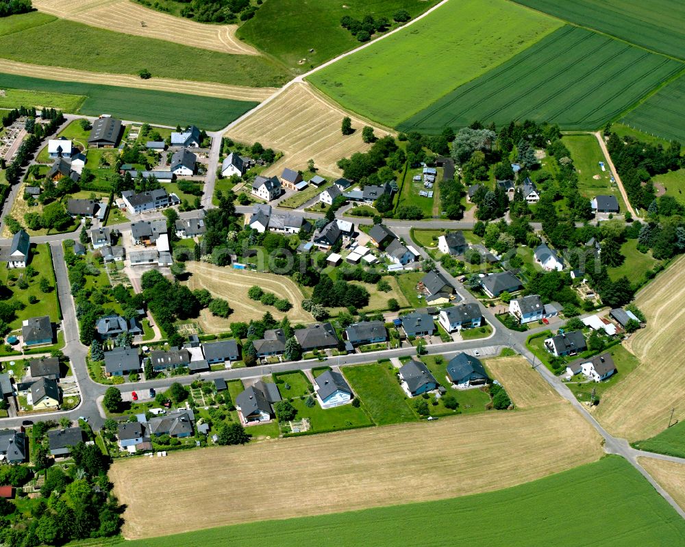 Aerial photograph Beulich - Agricultural land and field boundaries surround the settlement area of the village in Beulich in the state Rhineland-Palatinate, Germany