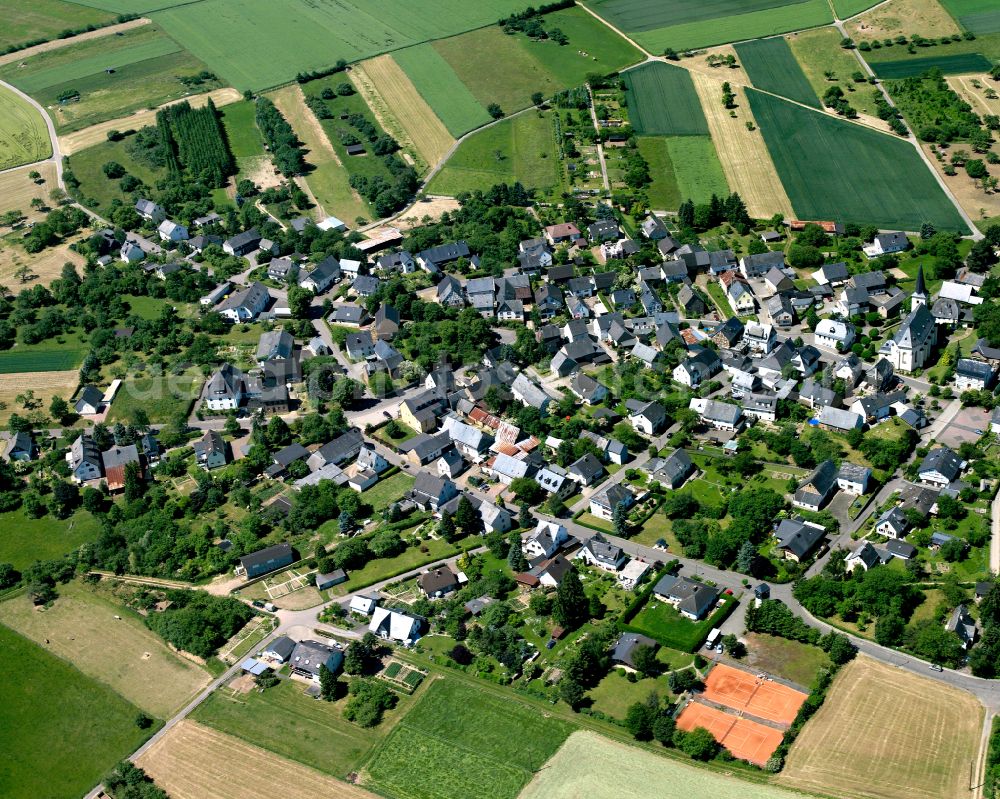 Beulich from above - Agricultural land and field boundaries surround the settlement area of the village in Beulich in the state Rhineland-Palatinate, Germany