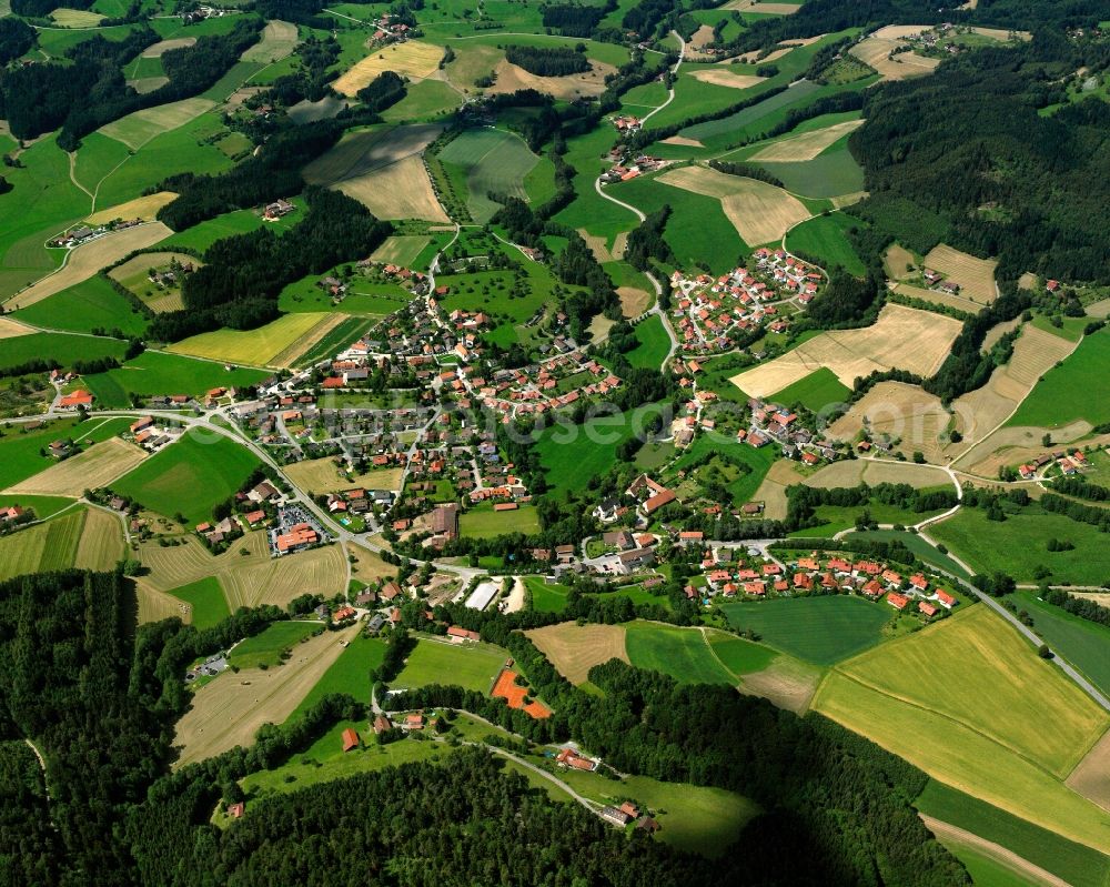 Aerial image Bühel - Agricultural land and field boundaries surround the settlement area of the village in Bühel in the state Bavaria, Germany