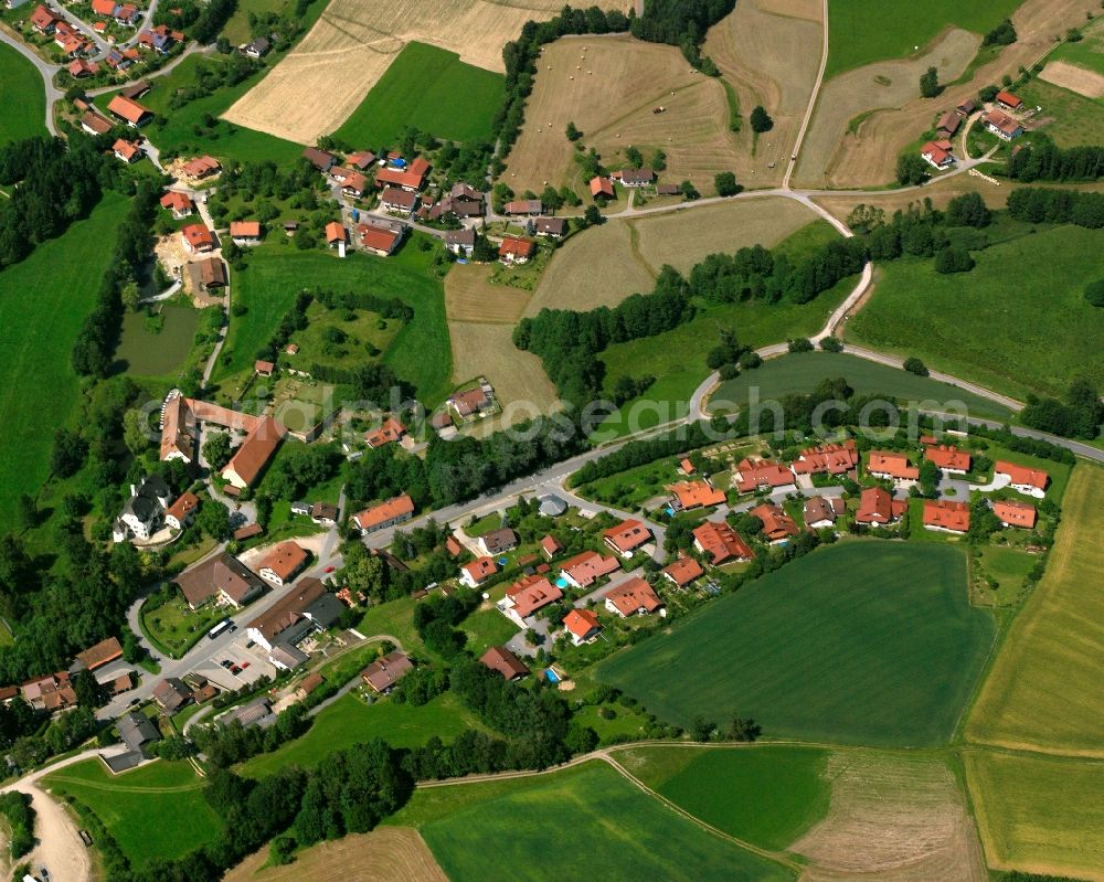 Aerial photograph Bühel - Agricultural land and field boundaries surround the settlement area of the village in Bühel in the state Bavaria, Germany