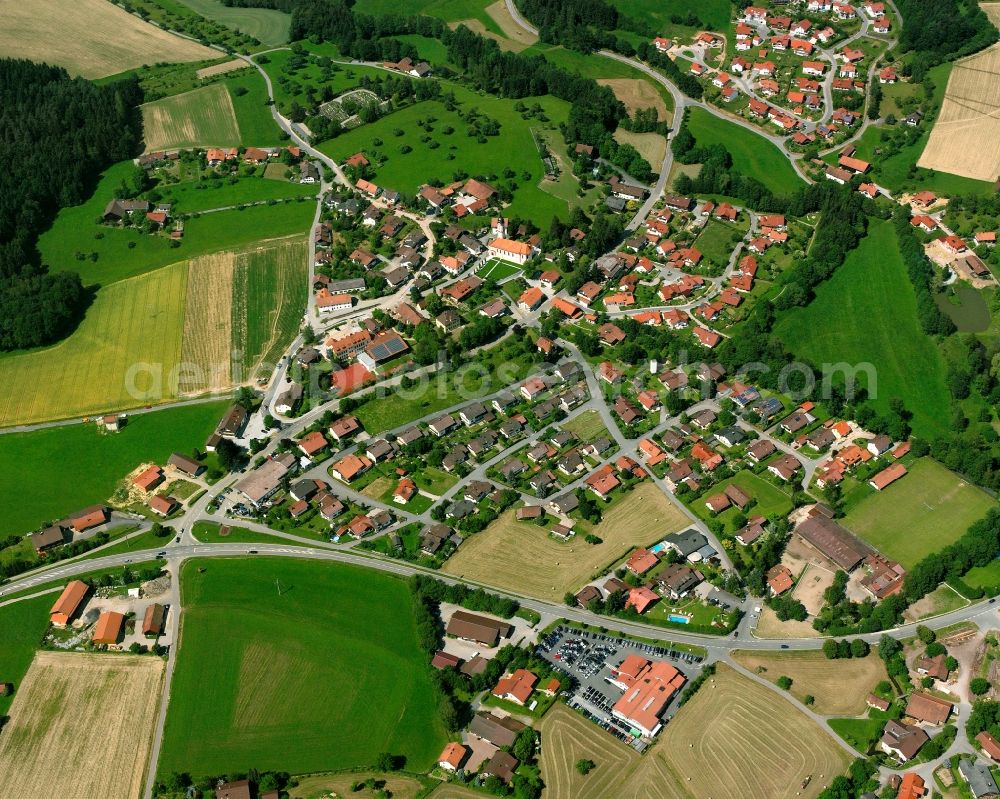 Bühel from above - Agricultural land and field boundaries surround the settlement area of the village in Bühel in the state Bavaria, Germany