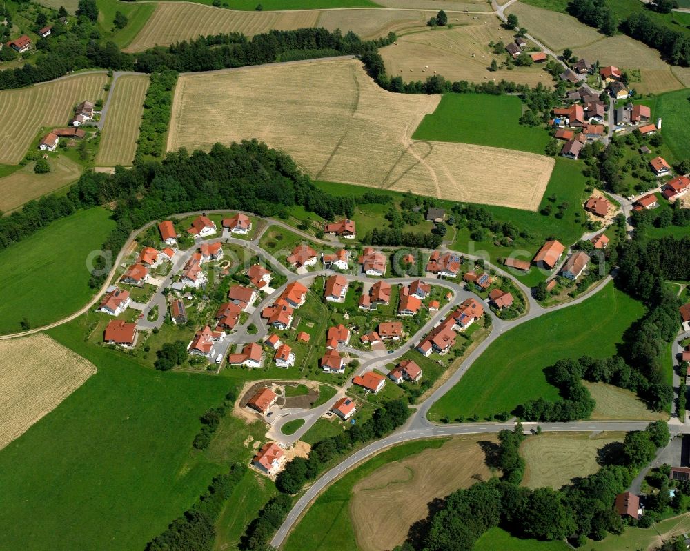 Bühel from the bird's eye view: Agricultural land and field boundaries surround the settlement area of the village in Bühel in the state Bavaria, Germany