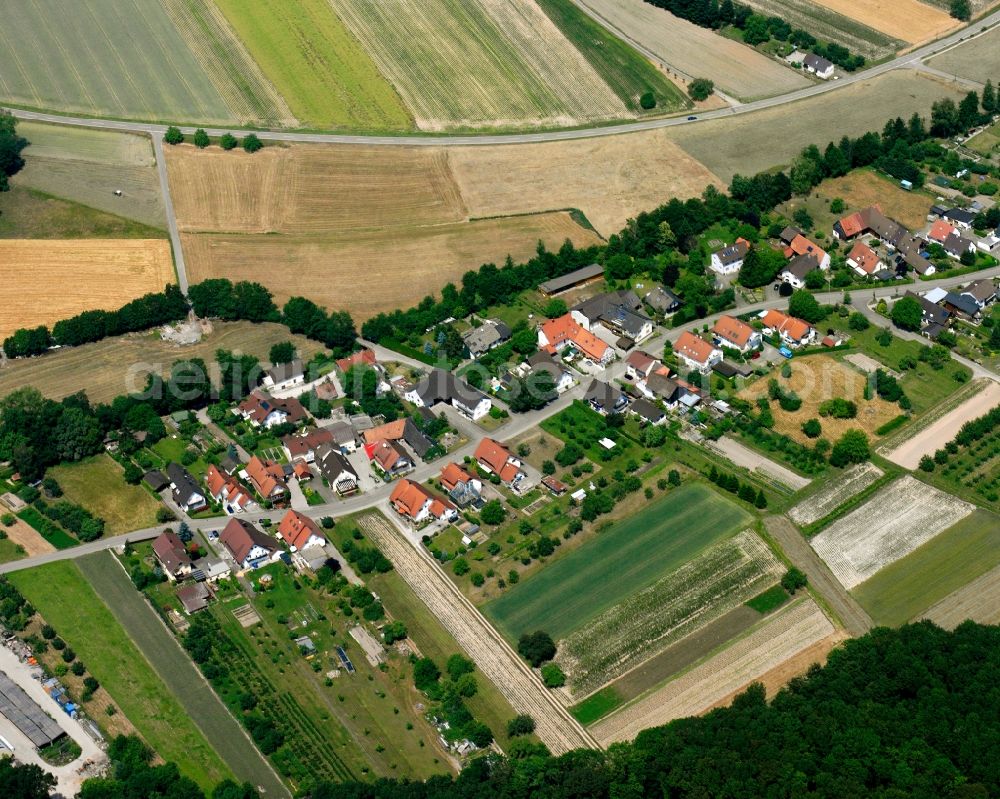 Bühl from the bird's eye view: Agricultural land and field boundaries surround the settlement area of the village in Bühl in the state Baden-Wuerttemberg, Germany