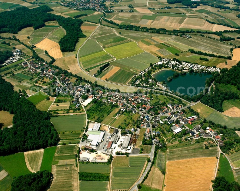 Bühl from above - Agricultural land and field boundaries surround the settlement area of the village in Bühl in the state Baden-Wuerttemberg, Germany