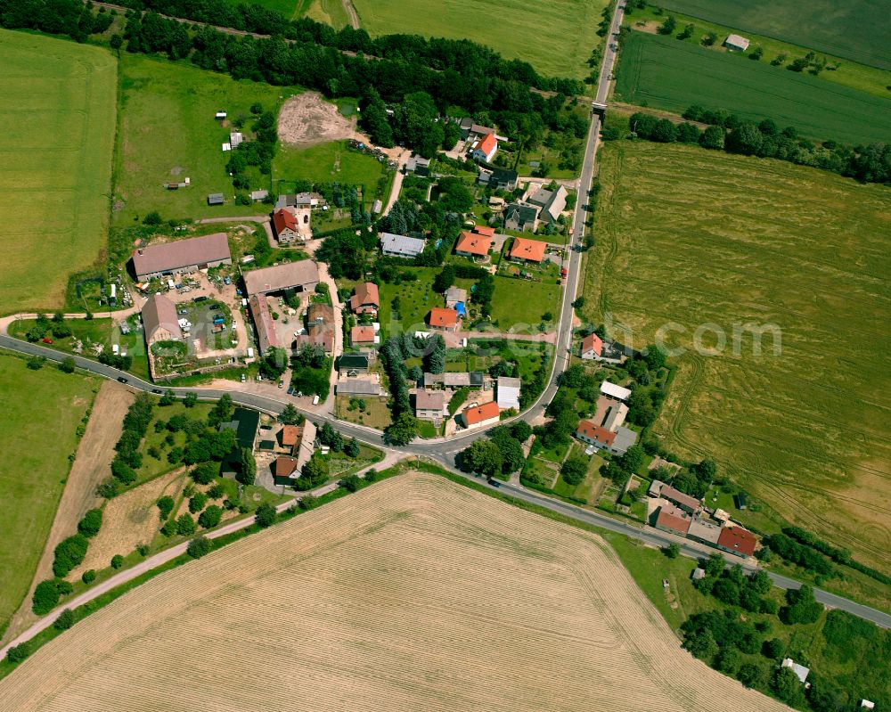 Böhlen from above - Agricultural land and field boundaries surround the settlement area of the village in Böhlen in the state Saxony, Germany