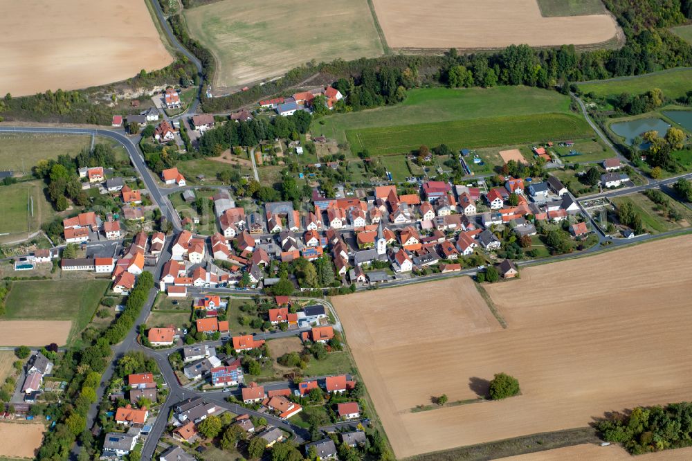 Aerial image Bühler - Agricultural land and field boundaries surround the settlement area of the village in Bühler in the state Bavaria, Germany