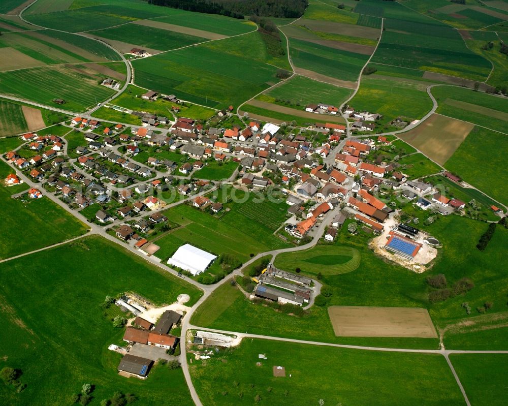 Böhmenkirch from the bird's eye view: Agricultural land and field boundaries surround the settlement area of the village in Böhmenkirch in the state Baden-Wuerttemberg, Germany