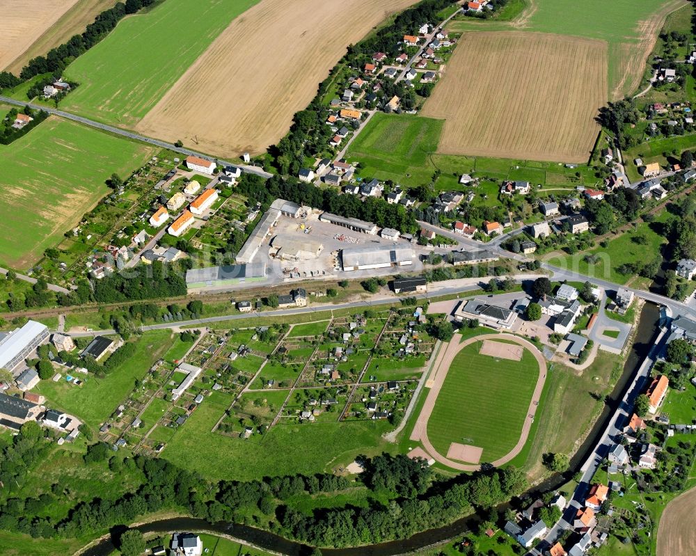 Aerial photograph Böhrigen - Agricultural land and field boundaries surround the settlement area of the village in Böhrigen in the state Saxony, Germany