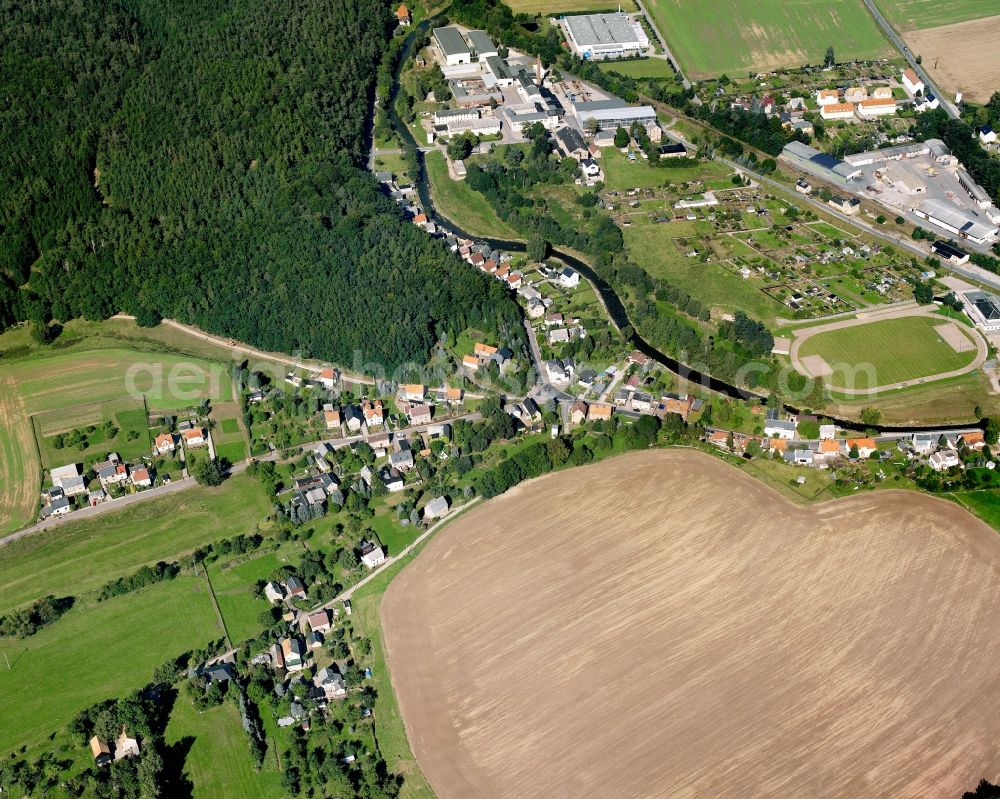 Aerial image Böhrigen - Agricultural land and field boundaries surround the settlement area of the village in Böhrigen in the state Saxony, Germany