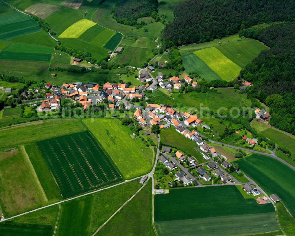 Aerial photograph Bieben - Agricultural land and field boundaries surround the settlement area of the village in Bieben in the state Hesse, Germany