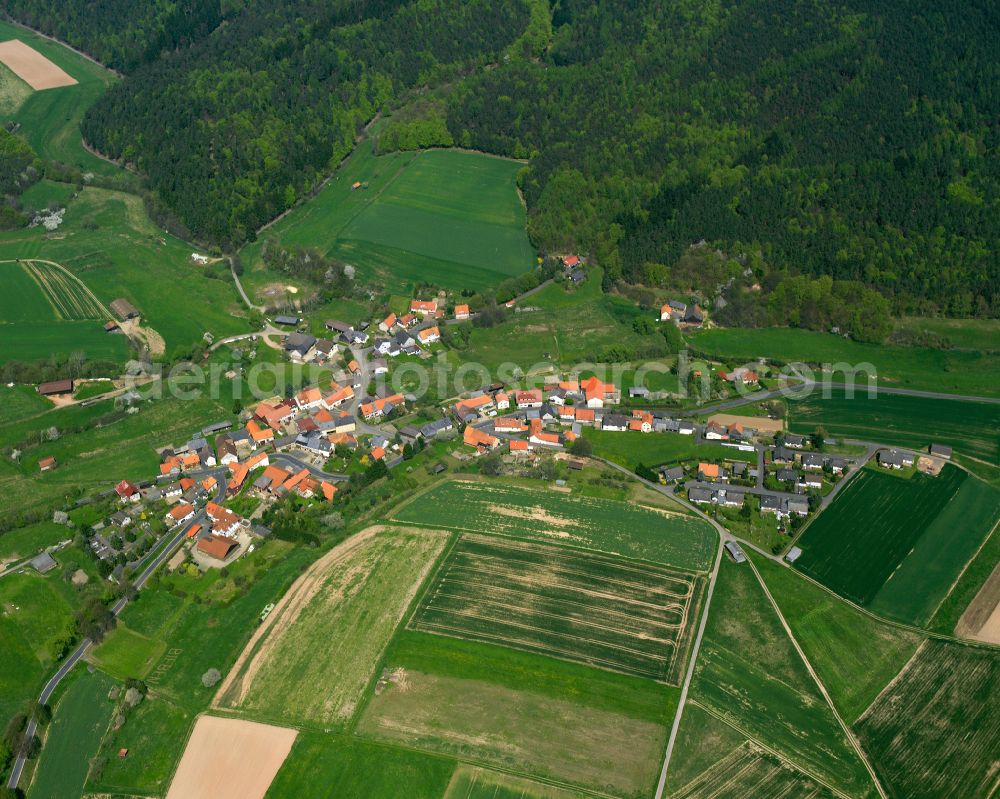 Aerial photograph Bieben - Agricultural land and field boundaries surround the settlement area of the village in Bieben in the state Hesse, Germany