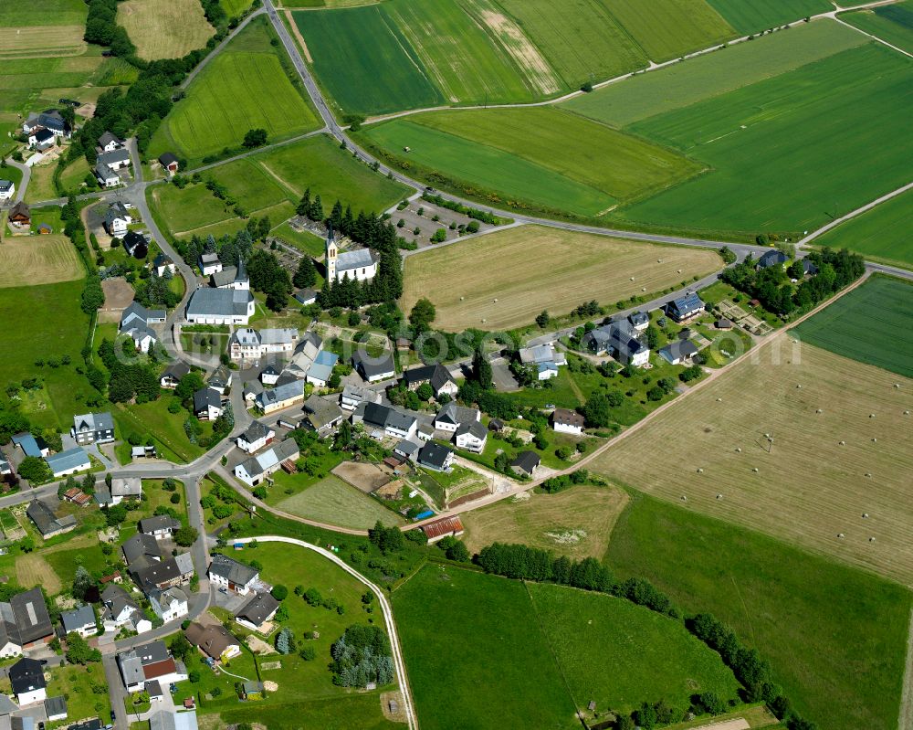 Biebern from the bird's eye view: Agricultural land and field boundaries surround the settlement area of the village in Biebern in the state Rhineland-Palatinate, Germany