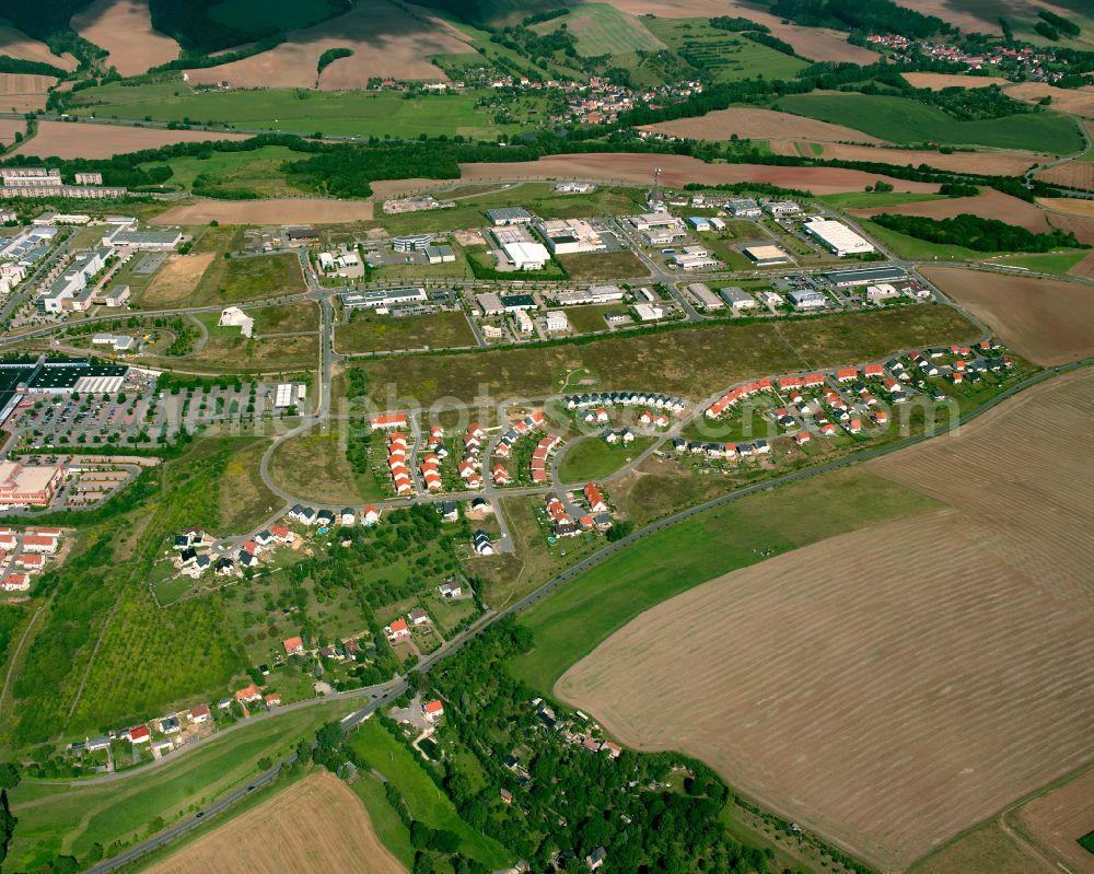 Bieblach from the bird's eye view: Agricultural land and field boundaries surround the settlement area of the village in Bieblach in the state Thuringia, Germany