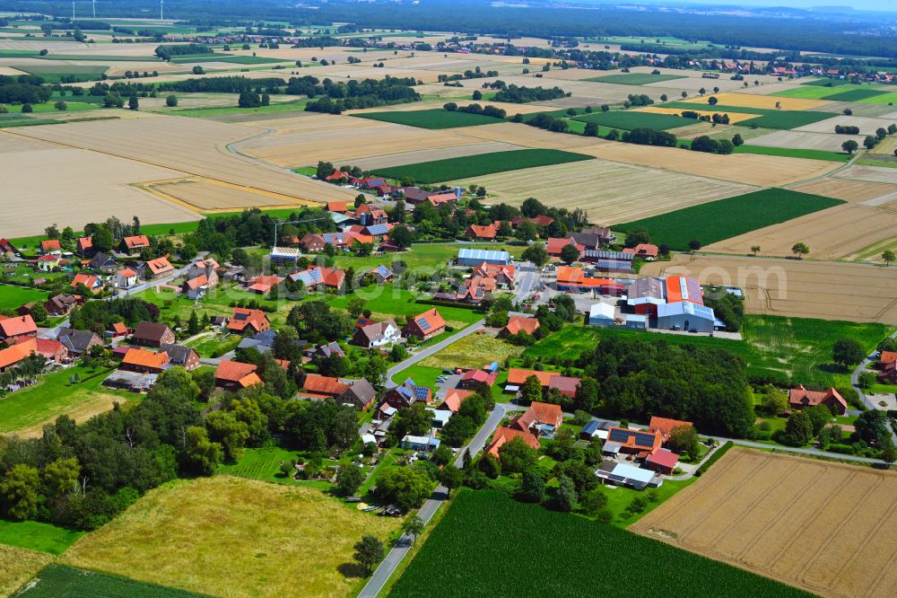 Bierde from above - Agricultural land and field boundaries surround the settlement area of the village in Bierde in the state North Rhine-Westphalia, Germany