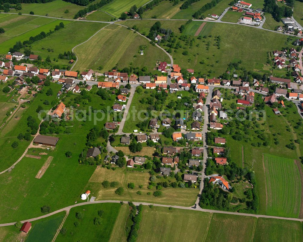 Aerial image Bieselsberg - Agricultural land and field boundaries surround the settlement area of the village in Bieselsberg in the state Baden-Wuerttemberg, Germany