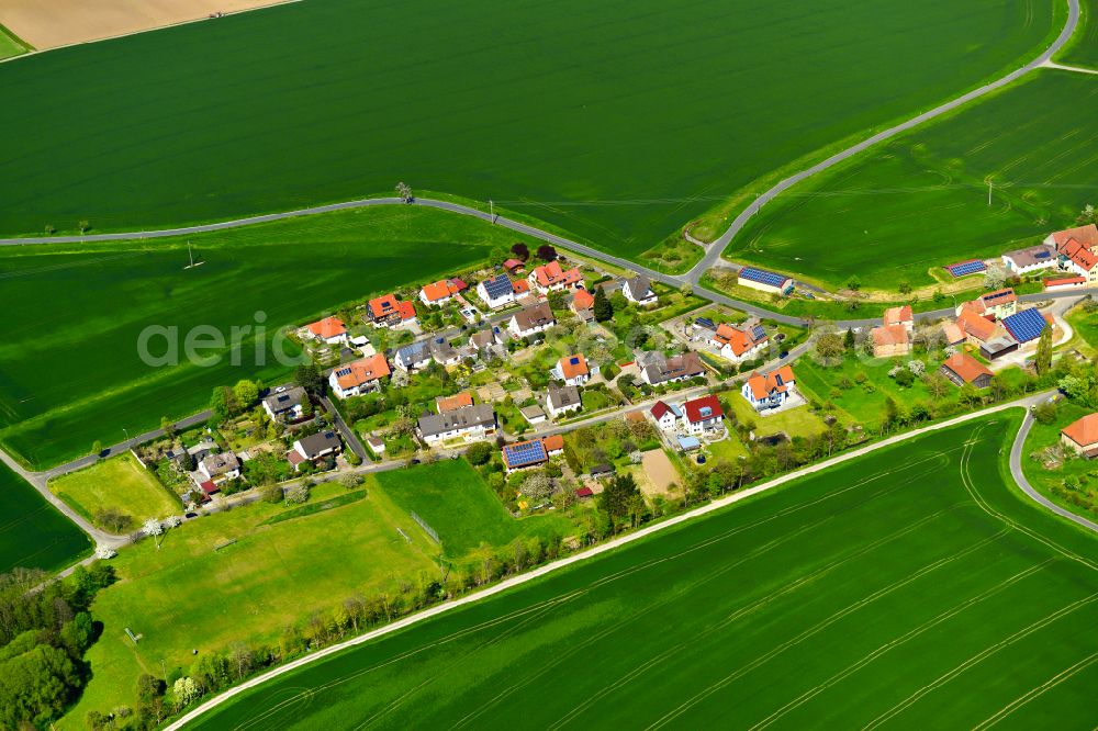 Aerial photograph Bimbach - Agricultural land and field boundaries surround the settlement area of the village in Bimbach in the state Bavaria, Germany