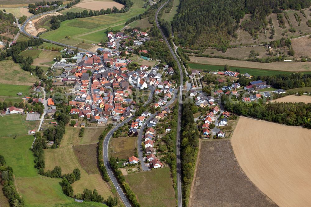 Aerial image Binsfeld - Agricultural land and field boundaries surround the settlement area of the village in Binsfeld in the state Bavaria, Germany